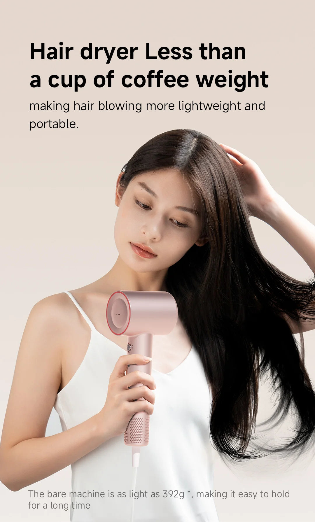 Woman holding a lightweight pink DOCO high-speed hair dryer with negative ions for fast, professional hair styling.