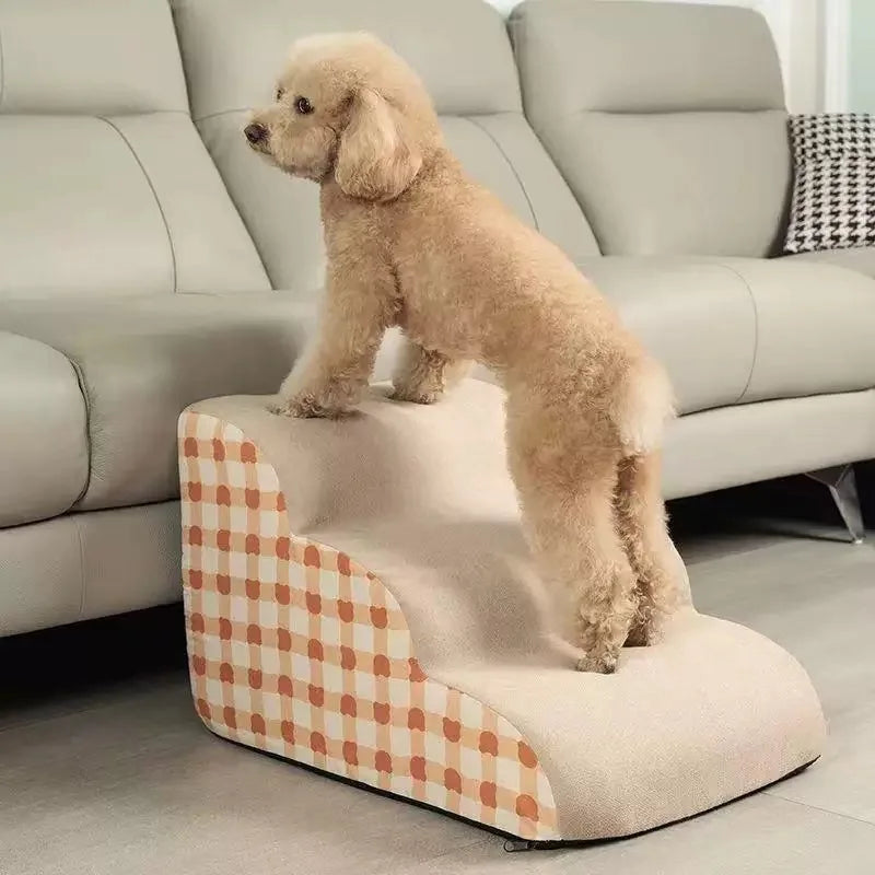 Small dog on anti-slip memory foam pet stairs for sofa access. Stable, washable 3-step ladder for easy pet climbing.