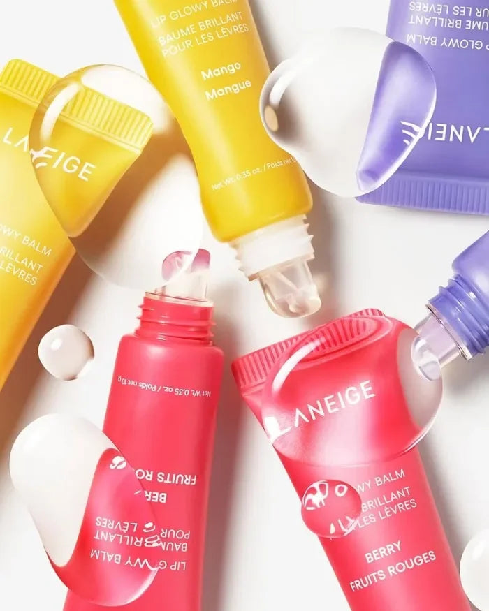 Laneige Glowy Lip Balm set in mango, berry, and grape, featuring glossy, hydrating textures for smooth, nourished lips.