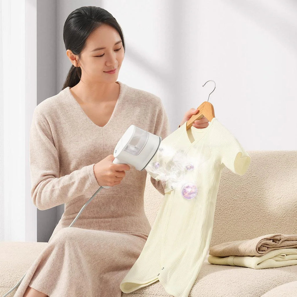 Tidesmit portable handheld garment steamer for clothes showing the steam nozzle and ergonomic handle design