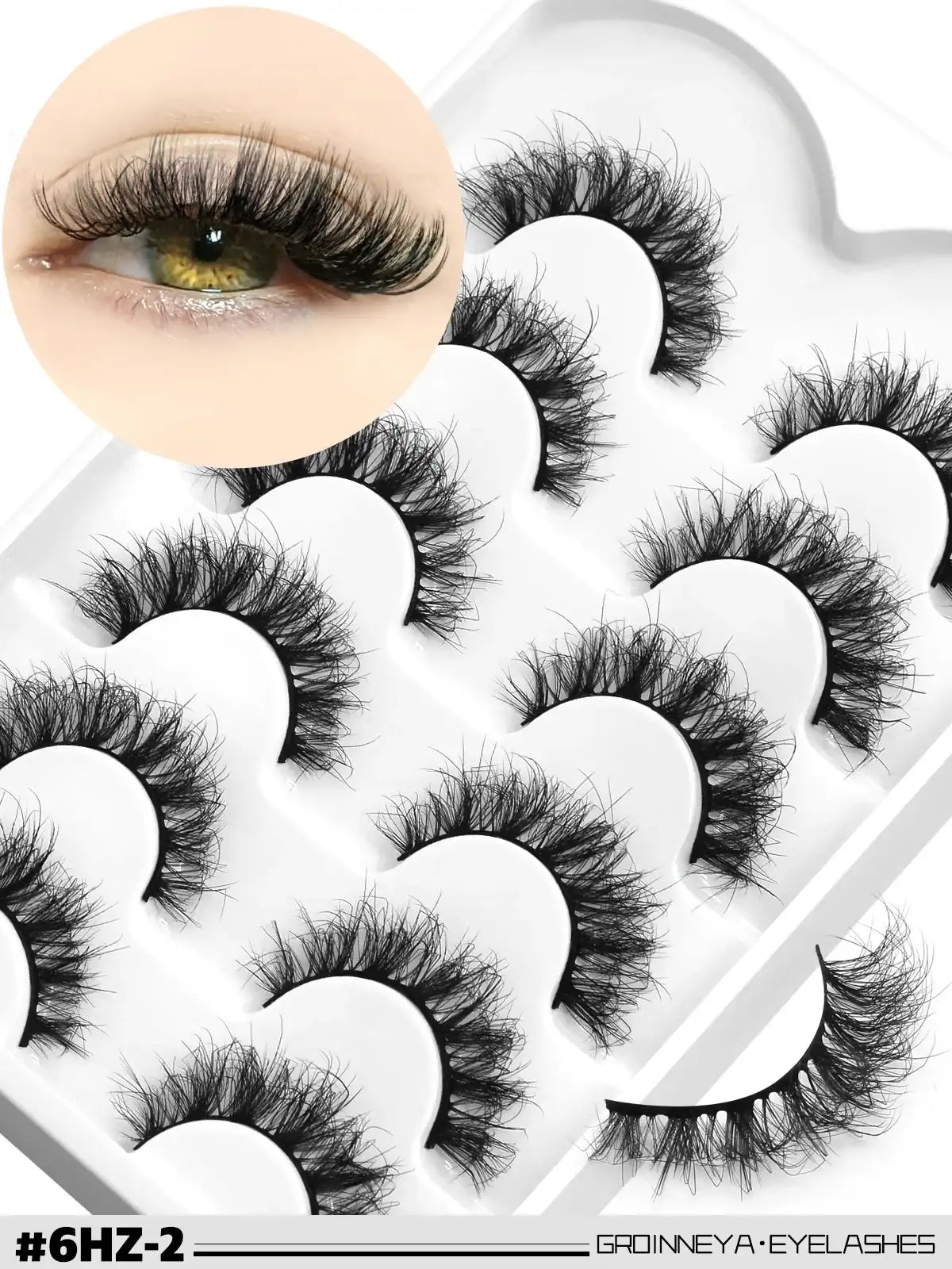 Pack of wispy, 3D black mink fake lashes with a cat-eye effect, displayed in a white tray with an eye sample inset.