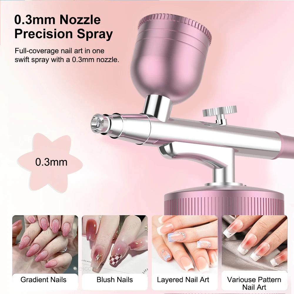 Portable pink airbrush nail machine with 0.3mm precision nozzle for nail art, makeup, and cake coloring.