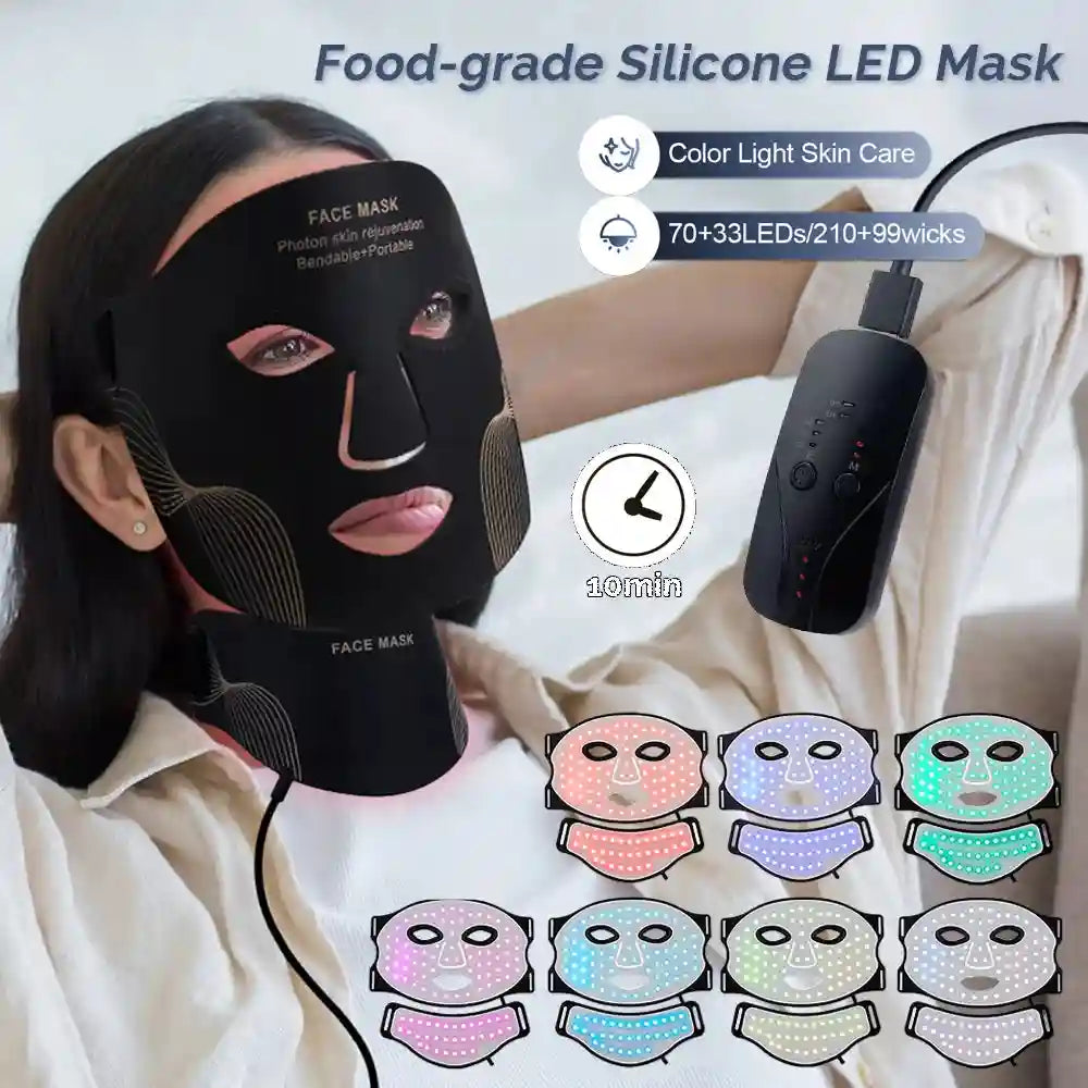 A woman wearing a flexible black silicone LED face and neck mask with a wired remote control and seven color settings.