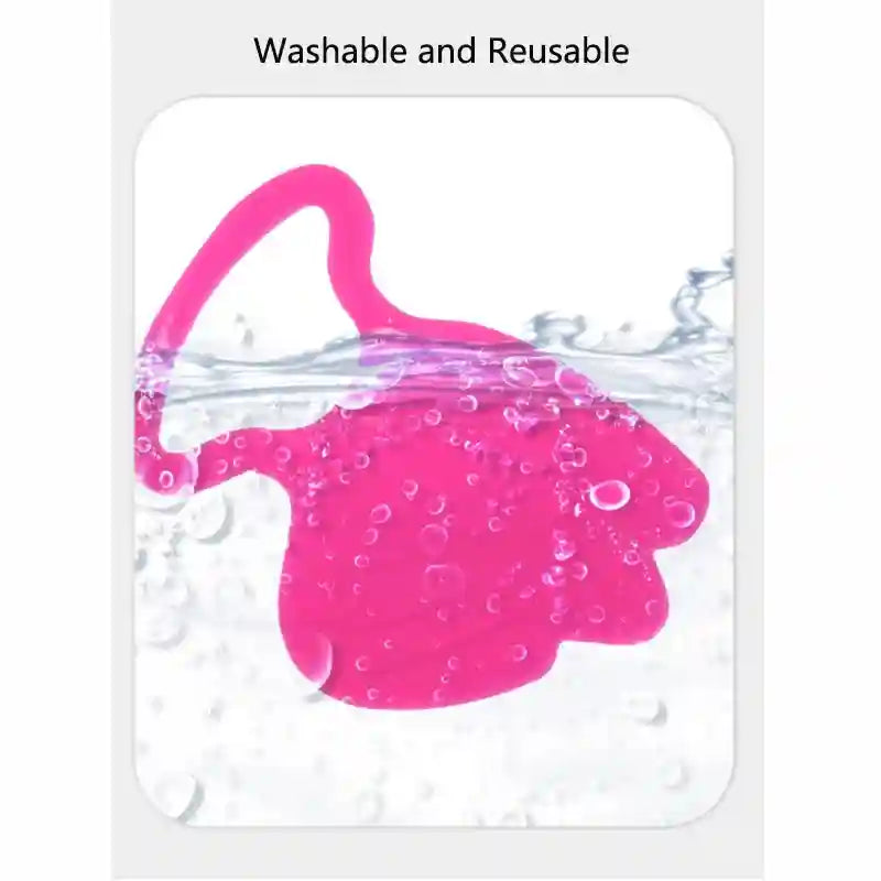 A bright pink, curved silicone anti-wrinkle patch being washed in water with bubbles.