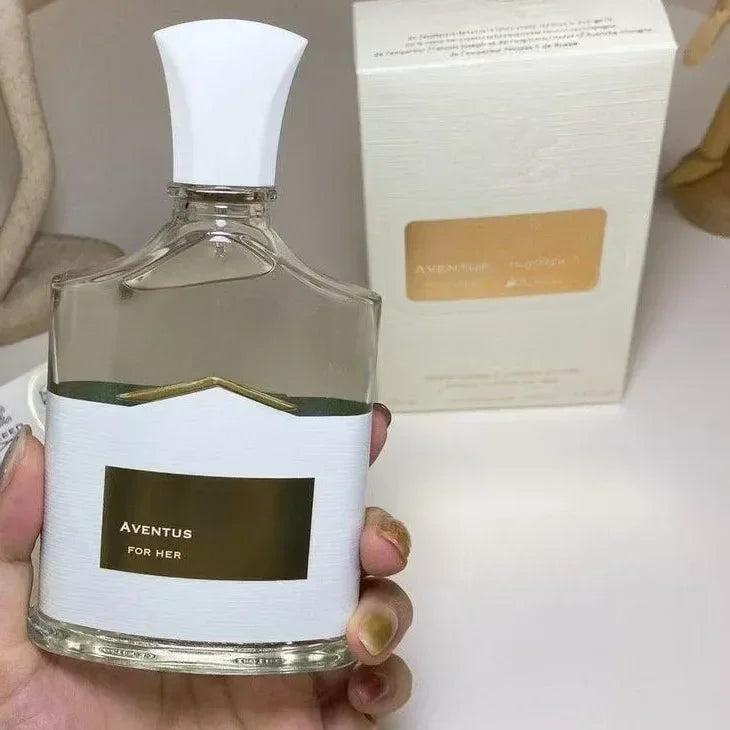Aventus for Her perfume: 100ml fruity floral fragrance in an elegant glass bottle with white cap and gold label.