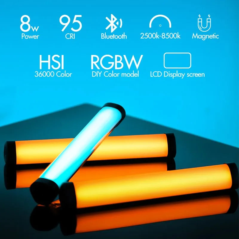 Three cylindrical RGBW LED light sticks with magnetic ends, displaying adjustable colors for creative photography.
