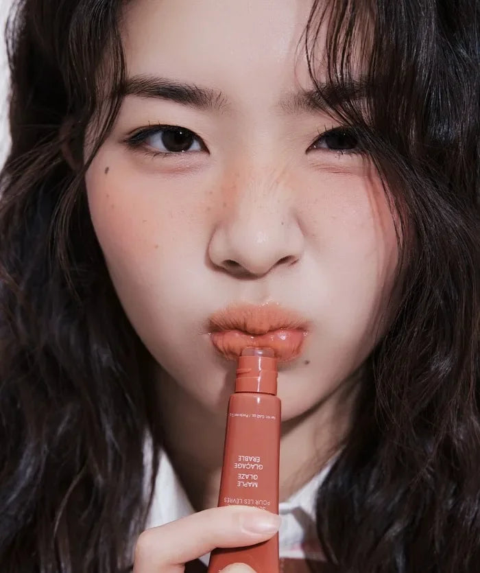 Laneige Lip Glowy Balm in Maple Glaze, a glossy, hydrating tinted lip treatment with a smooth, shiny finish.