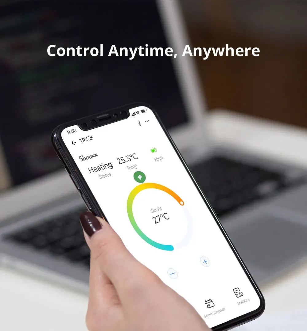 Hand holding a smartphone controlling radiator heating temperature remotely