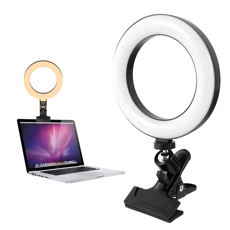 Black LED ring light with a clip-on mount for attaching to laptop screens for video conferencing lighting.