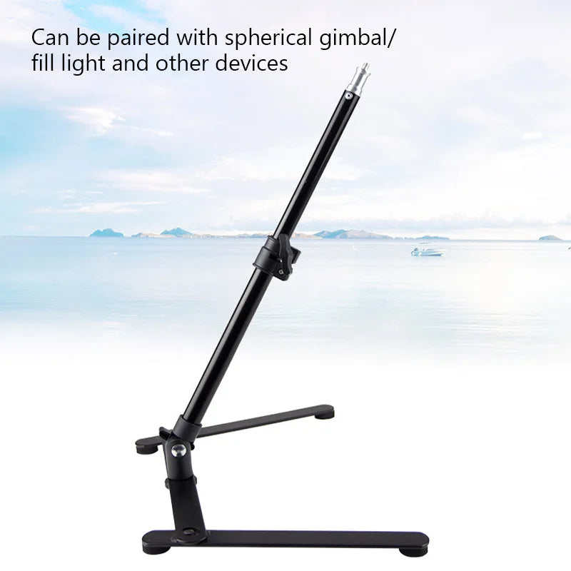Black metal tabletop stand with an adjustable pole for mounting photography lights and gimbals.