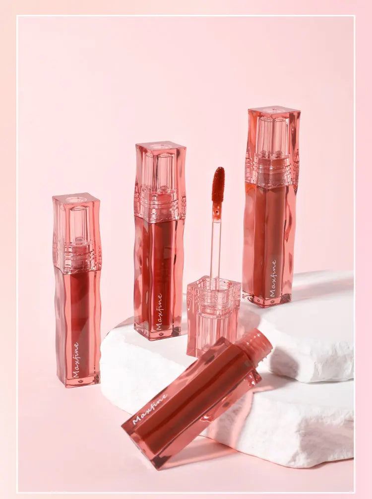 Highly pigmented, long-wearing liquid lipstick with a moisturizing gloss finish in elegant clear square packaging.