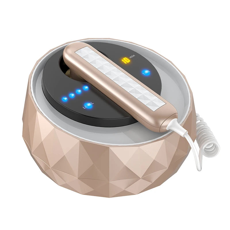 Rose gold, faceted beauty device base with a matching handheld applicator featuring a digital time and level display.