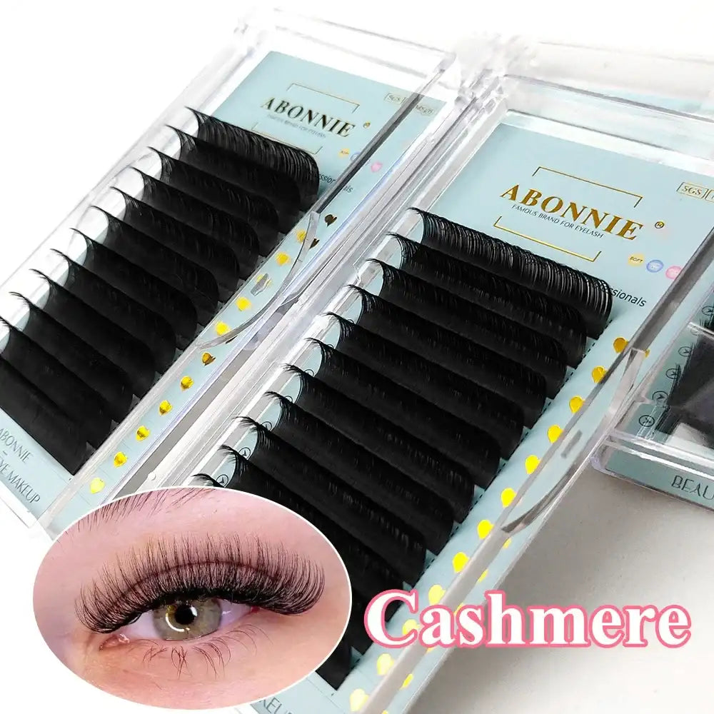 Abonnie ultra-matte black individual cashmere eyelash extensions in a clear display case, with an eye application inset.