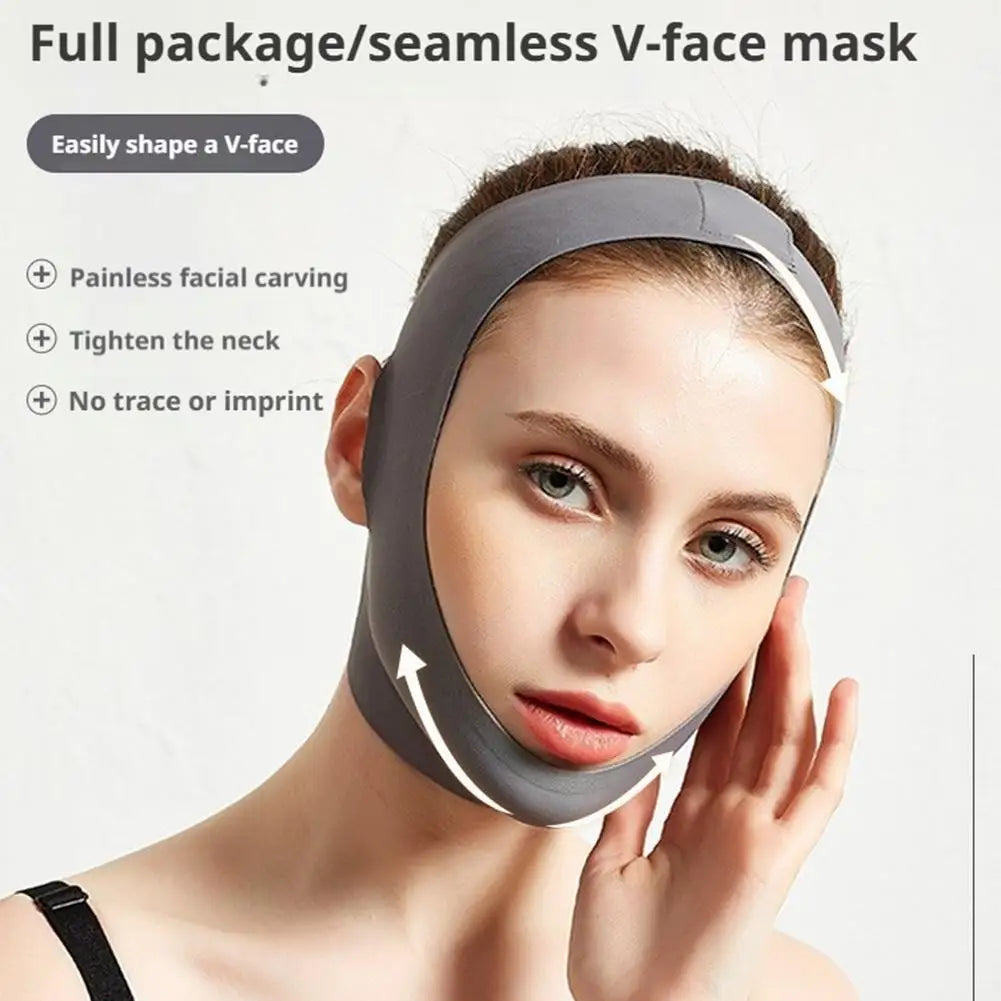 A woman wears a grey, seamless, elastic V-face slimming mask that wraps around her chin and over the top of her head.