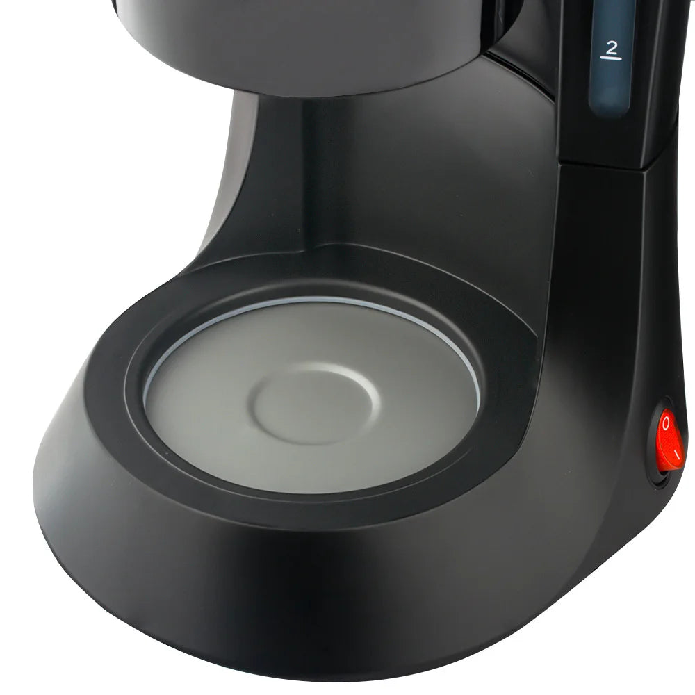 Black compact drip coffee maker base with warming plate and 2-cup water level indicator on white background.