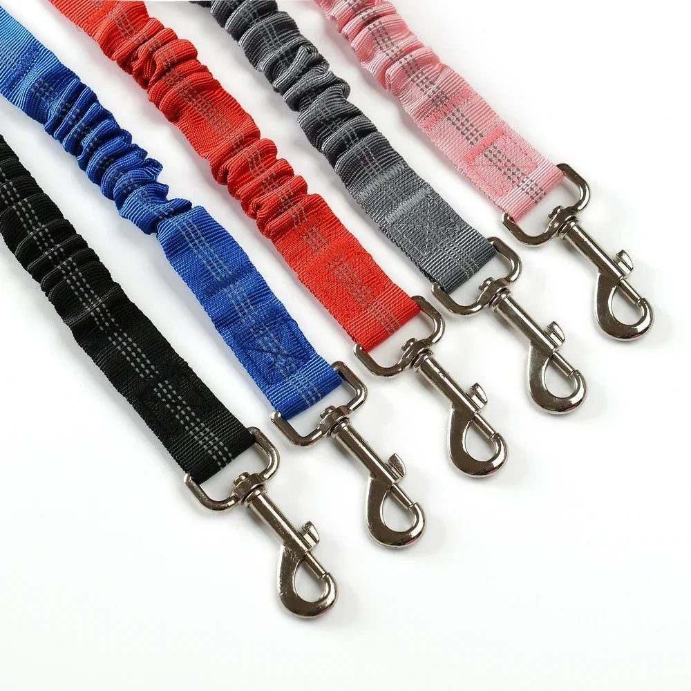 Adjustable reflective elastic dog car seat belt leash in various colors for safe pet travel for small to large dogs.
