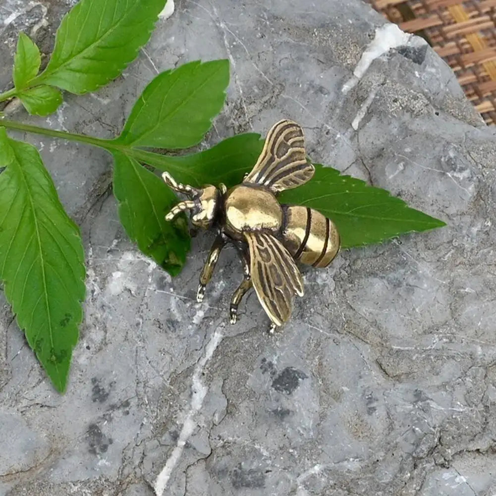 Solid brass bee tea pet figurine, a detailed golden metal sculpture for desk decor and tea ceremonies.