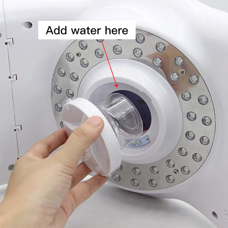 Hand filling water reservoir on an 8-color LED light therapy mask machine for home facial skin rejuvenation.