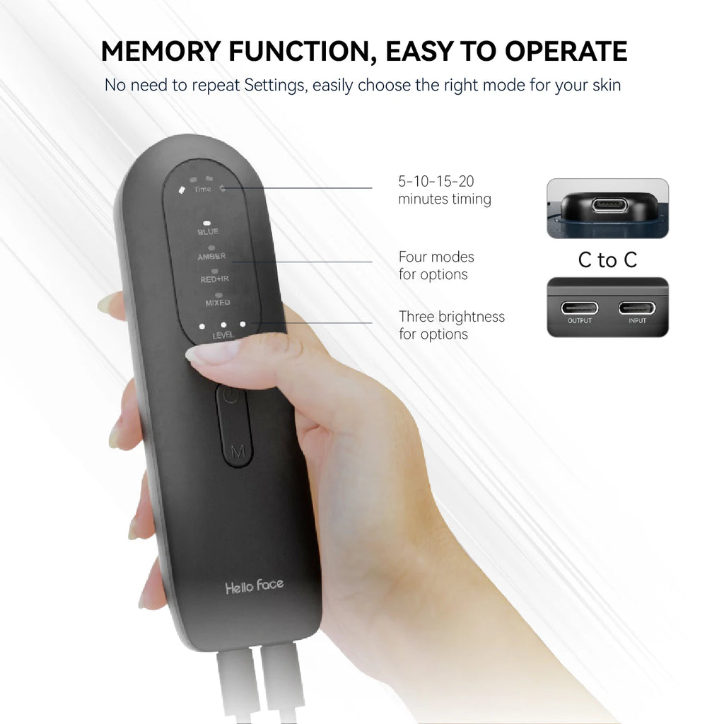 A hand holding a black, oval-shaped LED light therapy remote with mode, timing, and brightness settings.