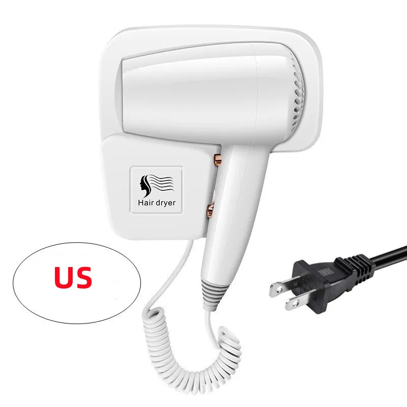 White wall-mounted hair dryer with US plug, coiled cord, and docking station for hotel or home bathroom use.