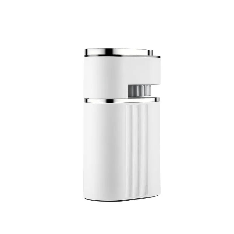 Compact white electric coffee grinder with metallic trim and adjustable grind setting dial isolated on white.