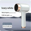 Ivory white portable cordless hair dryer with rose gold accents, featuring hot and cold air modes for travel use.