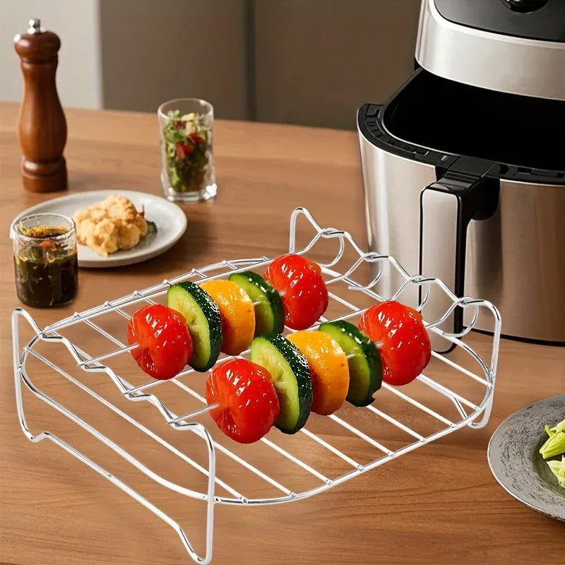 Air fryer skewer grill rack with four skewers, holding tomato and zucchini pieces