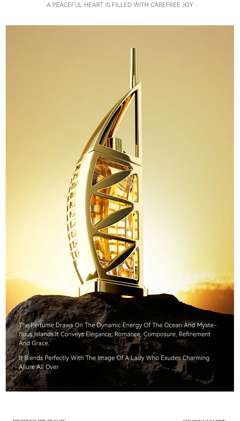 Gold-colored perfume bottle shaped like a sail on a rock pedestal, designed for personal fragrance application.