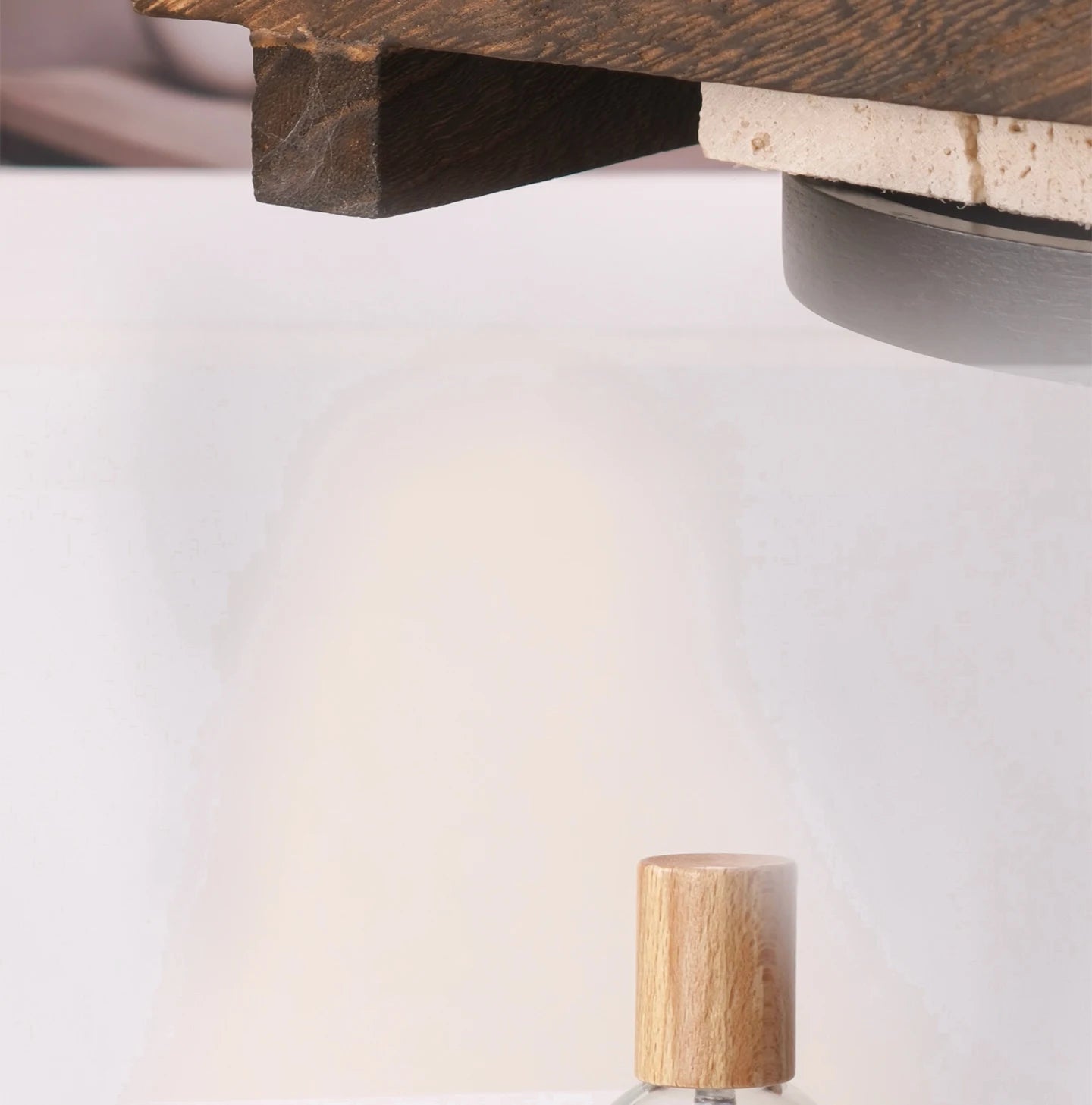 Elegant Pure Gardenia perfume bottle with a textured wooden cap against a clean white and rustic wood background.
