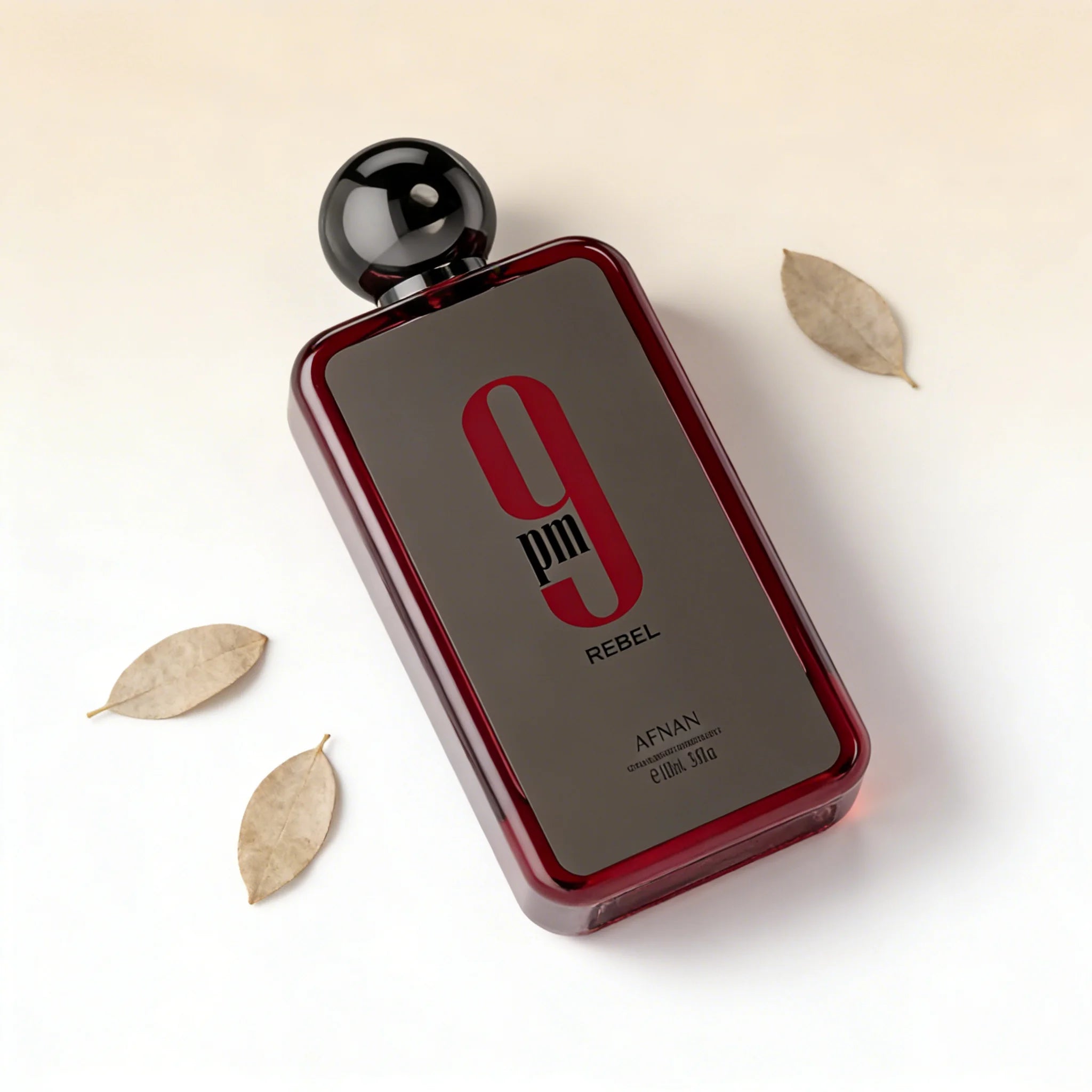 Afnan 9pm Rebel EDP 3.4oz: Masculine woody oud fragrance in a sleek, rectangular red glass bottle with round cap.