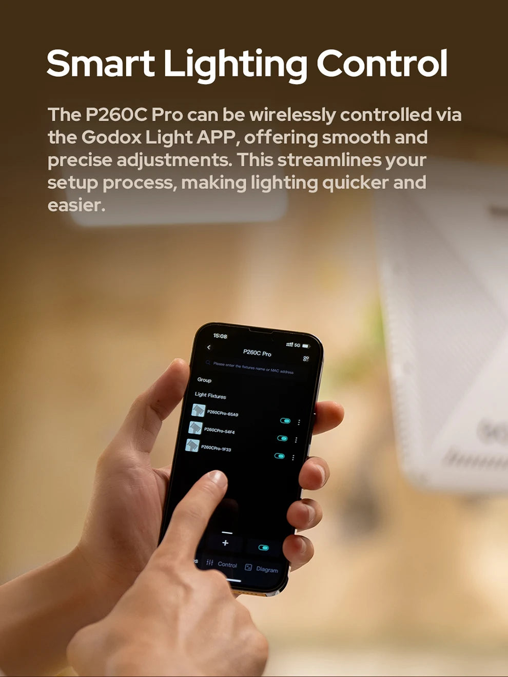 Hand holding a smartphone displaying the P260C Pro light control app interface for wireless lighting adjustments.