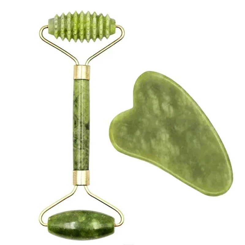 Green jade facial roller with ridged and smooth ends and a matching heart-shaped gua sha tool for skin massage.