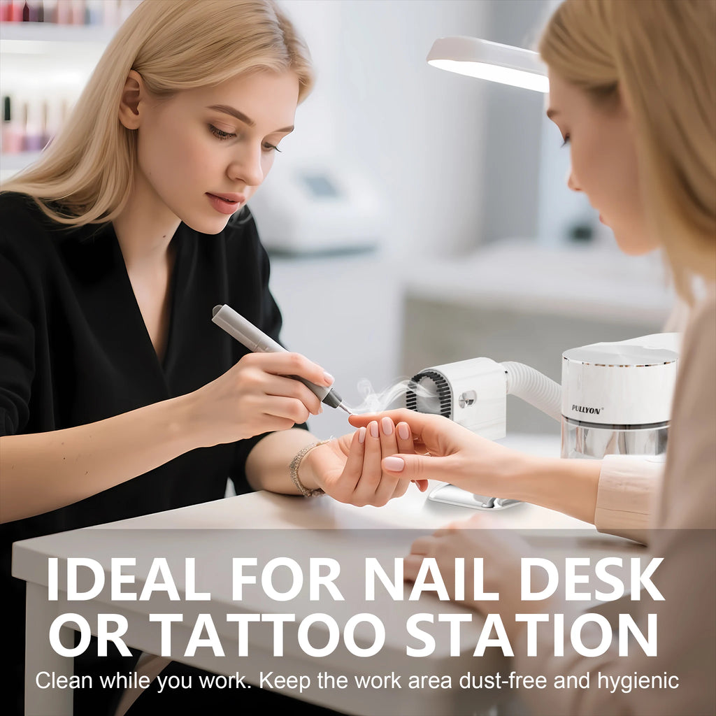 Compact white nail dust vacuum with powerful suction and filter for home salon nail art and tattoo workstations.