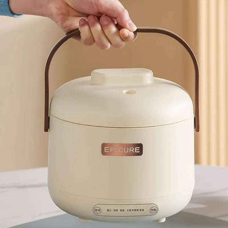 White mini electric rice cooker with lid and brown carry handle, compact countertop size.