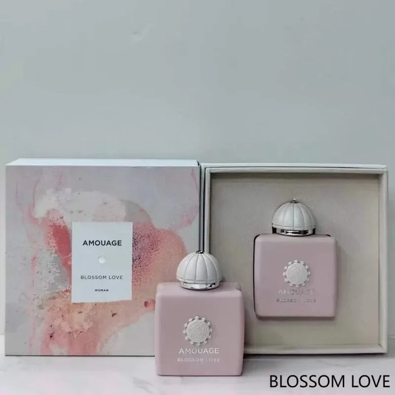 Blossom Love perfume set featuring two square, light pink bottles with white dome caps in a decorative gift box.