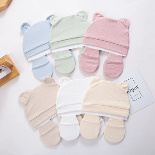 Tidesmit 3-piece sets of soft ribbed cotton baby beanies with bear ears and matching mittens in six pastel colors.