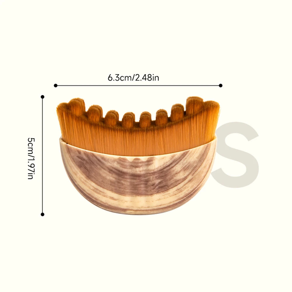 Crescent-shaped facial massage brush with brown bristles and a wood-grain patterned handle, showing dimensions.