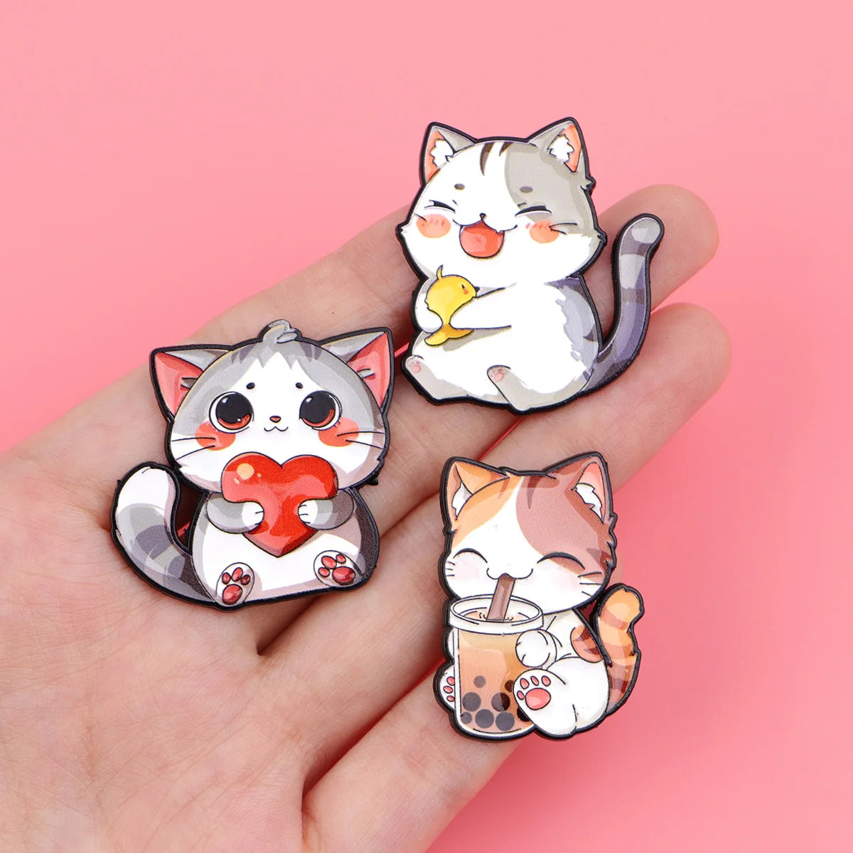 Cute cat enamel pins for backpacks, featuring cartoon kittens holding heart, boba, and bird. Perfect fashion gift.