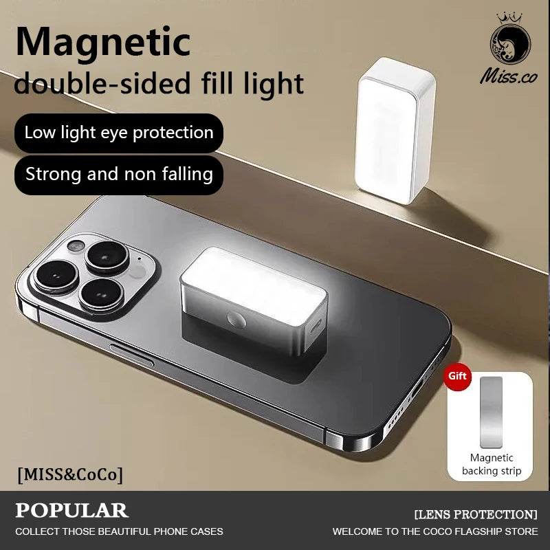 Small rectangular white magnetic fill light attached to a smartphone, with an extra magnetic backing strip included.