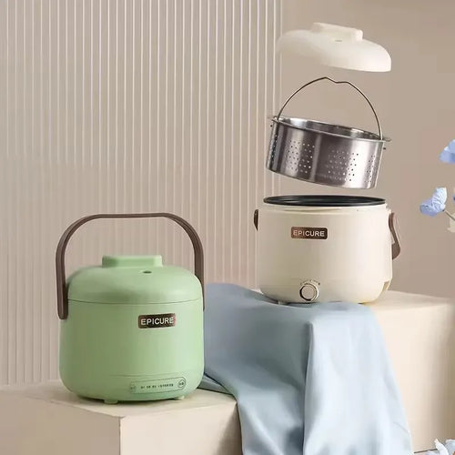 White and green electric rice cooker with stainless steamer insert and handles