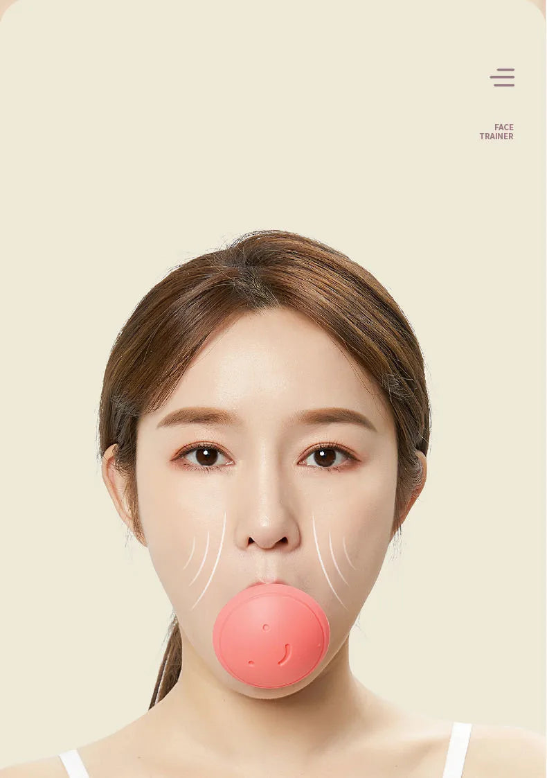 A woman holding a round, pink silicone face-slimming exerciser in her mouth against a light beige background.