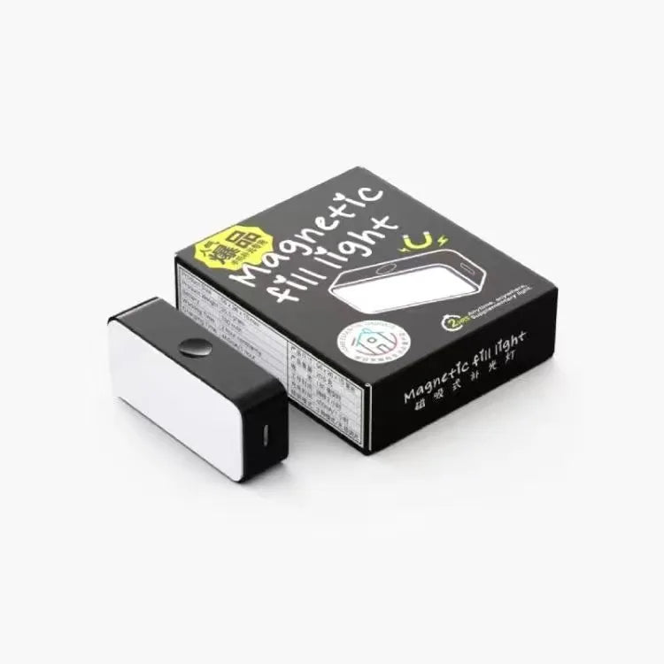 Small, rectangular black magnetic fill light with a white front panel next to its black product packaging box.