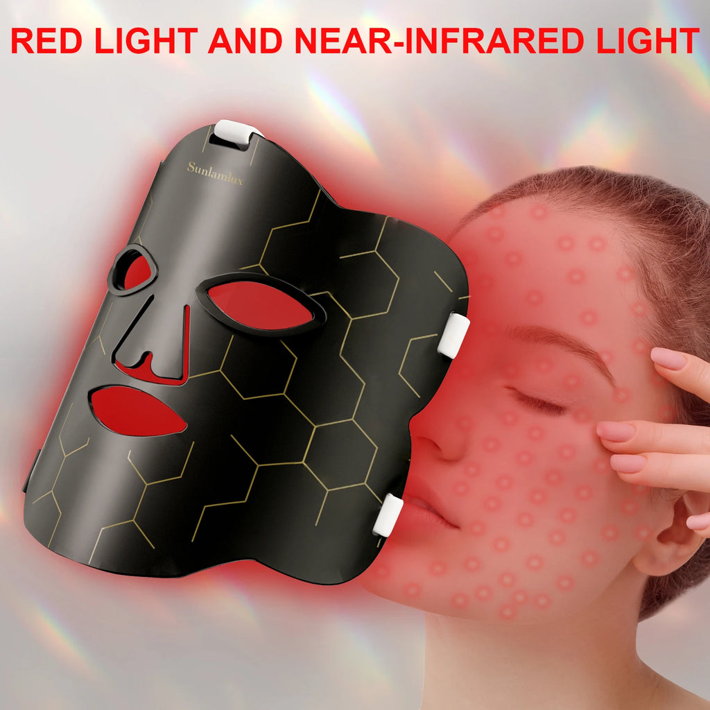 Black silicone LED face mask for red light therapy with gold geometric pattern worn by woman for skin care.