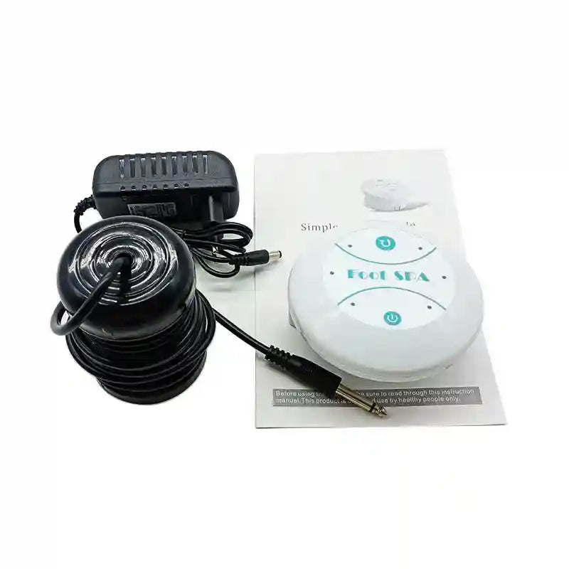Ionic foot detox spa machine with white control unit, black ion cleanse array, power adapter, and user manual.