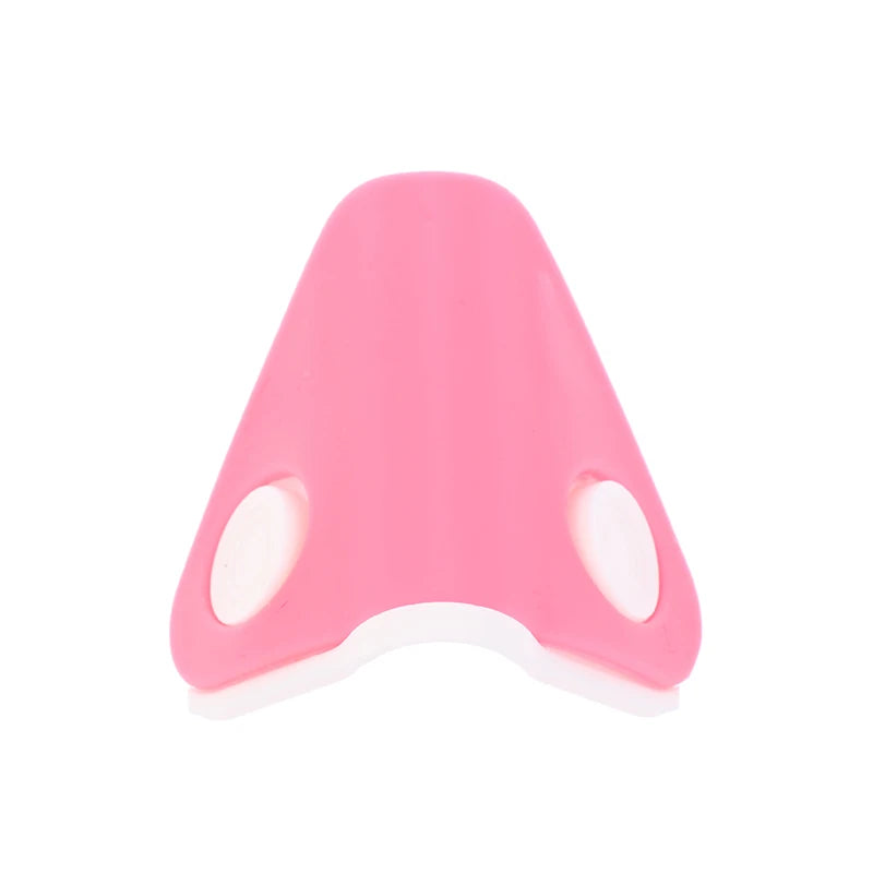 Pink nose shaper clip for lifting and straightening, silicone facial beauty tool with white pads for nose bridge.