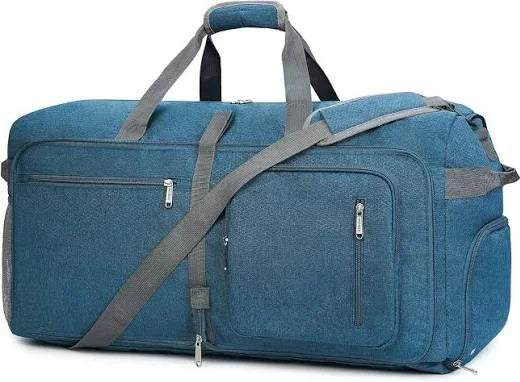 Large blue canvas unisex duffle bag with shoe compartment, custom logo space, and adjustable shoulder strap.