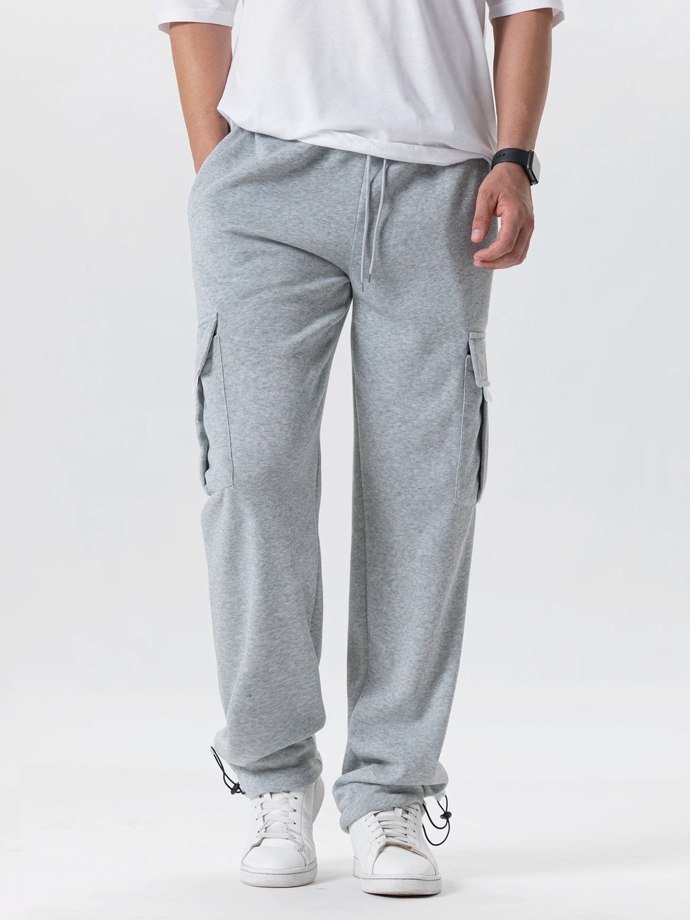Tidesmit men's grey loose-fit sweatpants with side cargo pockets, drawstring waist, and adjustable drawstring cuffs.