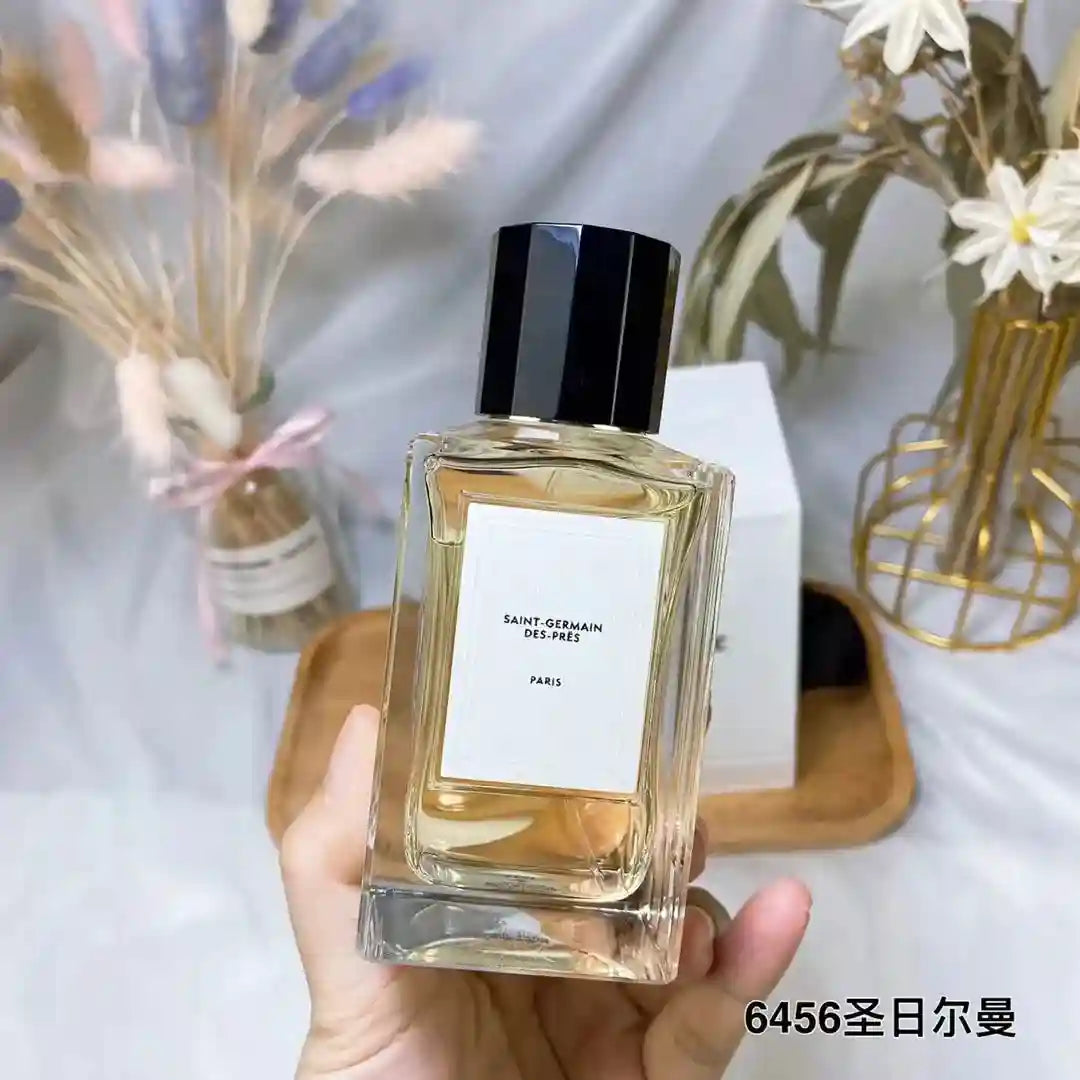 Saint-Germain-Des-Prés unisex perfume in a sleek rectangular glass bottle with black cap. Long-lasting luxury fragrance.