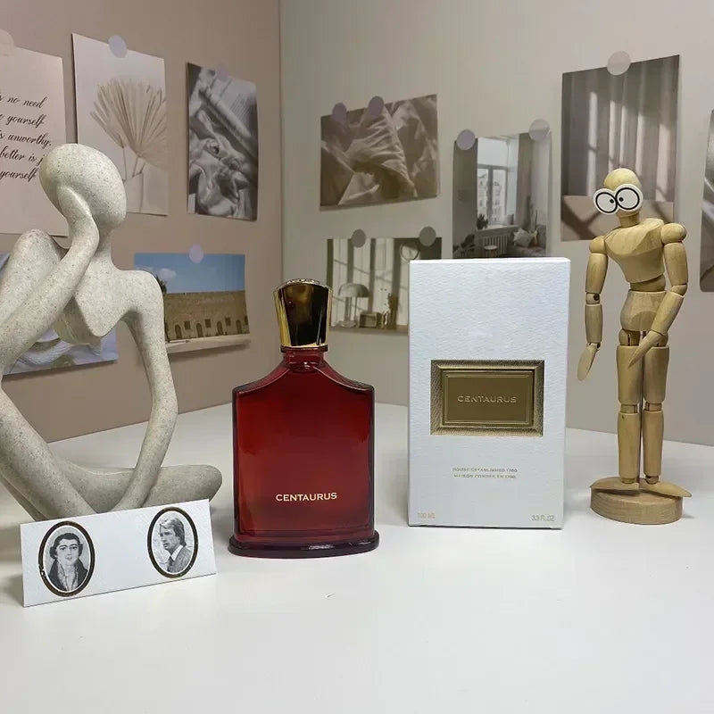 Centaurus unisex Eau de Parfum: Red glass bottle with gold cap, luxury niche fragrance spray for men and women.