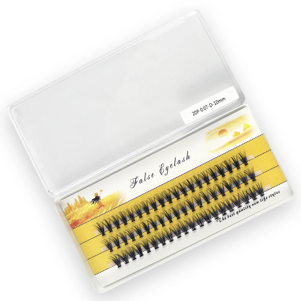 Box of black 3D individual cluster mink eyelash extensions, arranged on three rows in a clear plastic case.